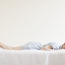 Attractive young woman sleeping in bed