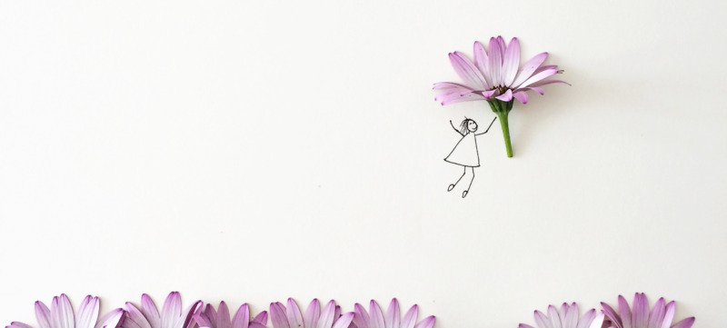 Conceptual girl picking flower