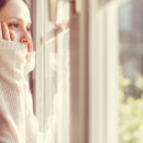 Girl looking through the window