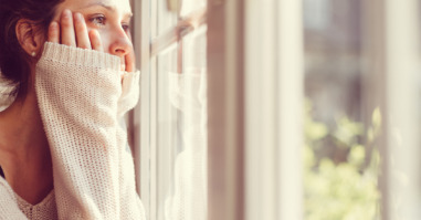 Girl looking through the window