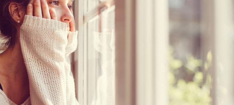Girl looking through the window