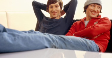 Twin brothers sitting at a table
