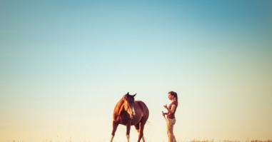 Young Woman Training Horse