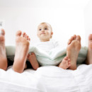 Baby in Bed with Mom and Dad
