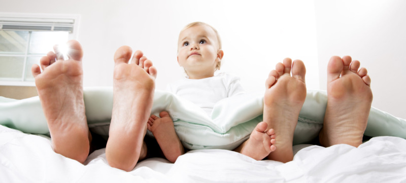 Baby in Bed with Mom and Dad