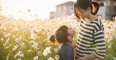 Mother and daughter are in the cosmos field