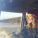 Woman looking out of camper van window.