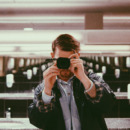 Man Photographing In Public Restroom