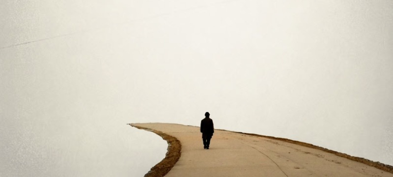 Man walking along a footpath