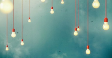 Photo of Hanging light bulbs with depth of field. Modern art