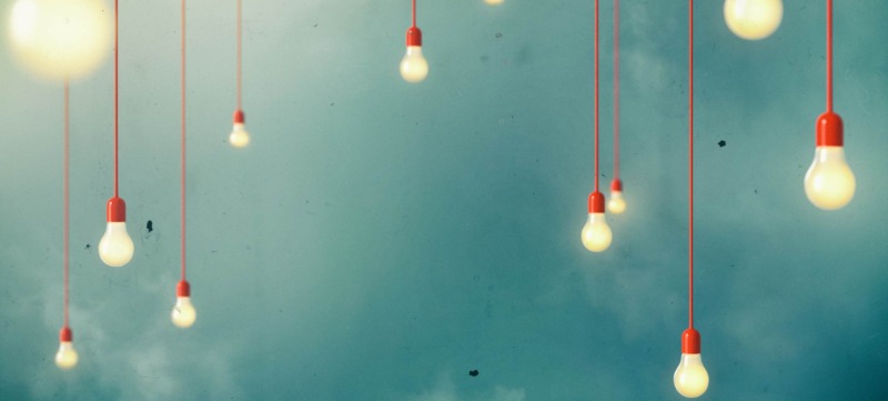 Photo of Hanging light bulbs with depth of field. Modern art