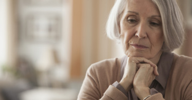 Senior Caucasian woman with chin in hands