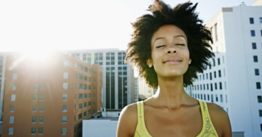 Mixed race woman on urban rooftop