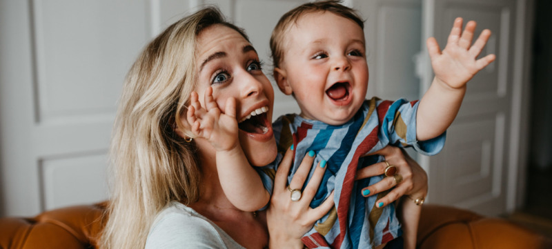 Cheerful Mother With Son At Home