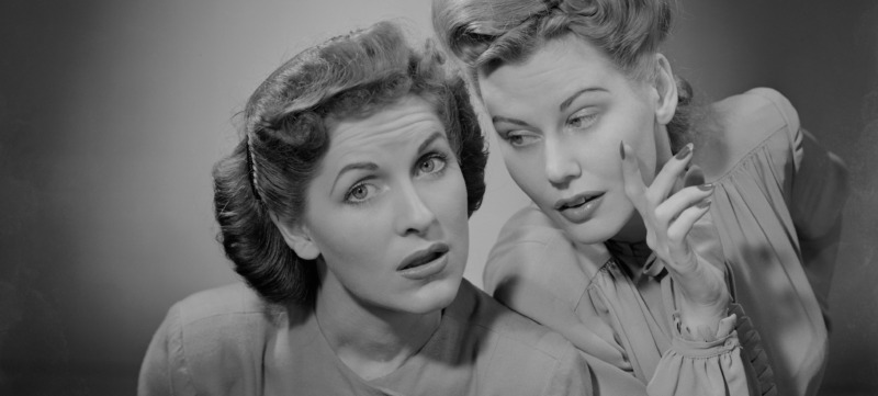 Two women talking indoors