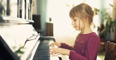 Little girl playing piano