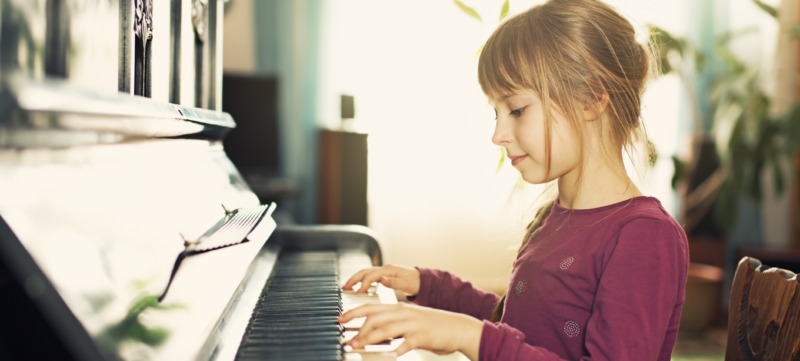 Little girl playing piano