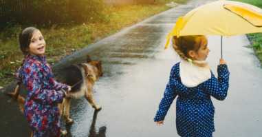 Girls walking with dog