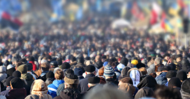 Crowd of anonymous people on street in city center