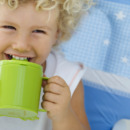 Young child drinking from a cup
