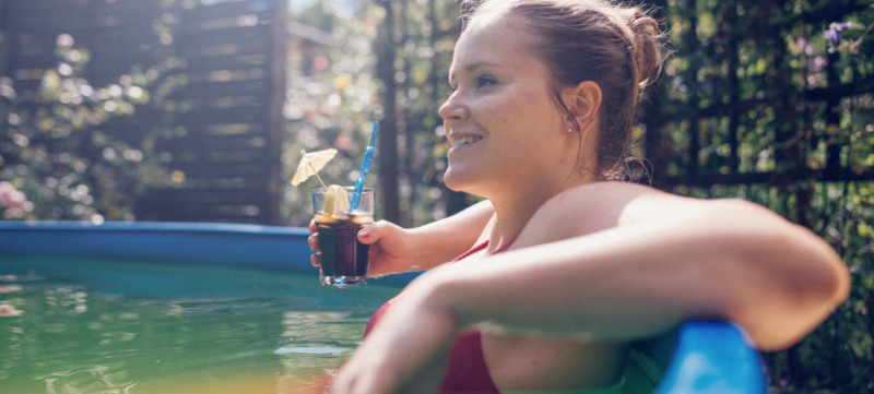 Woman relaxing in pool.