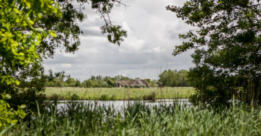 a rural view of a Dutch farmland with overcast skies