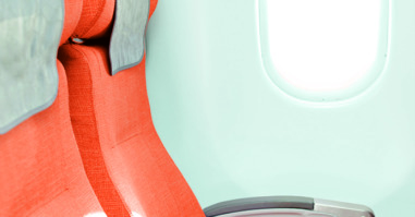 orange seats in airplane