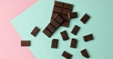 Chocolate pieces on color block background