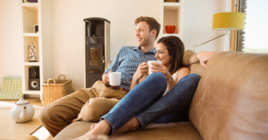 Happy young couple relaxing on the couch