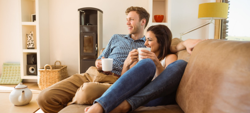 Happy young couple relaxing on the couch