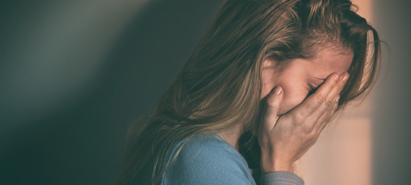 Woman sitting alone and depressed