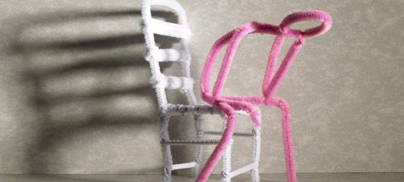 Sad Pink stick figure sitting on a white chair