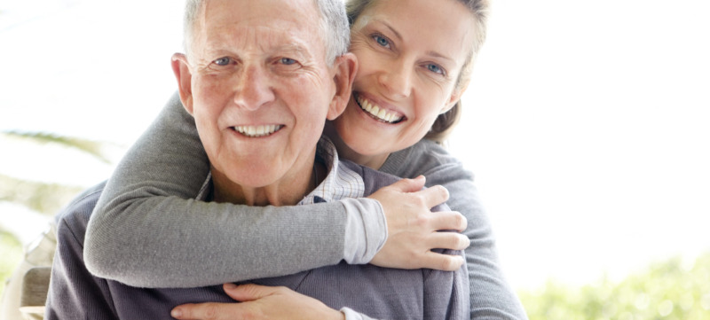 Beautiful young woman embracing her father