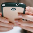 Woman Holding a Mobile Phone