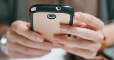 Woman Holding a Mobile Phone