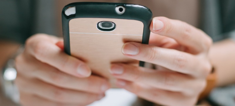 Woman Holding a Mobile Phone