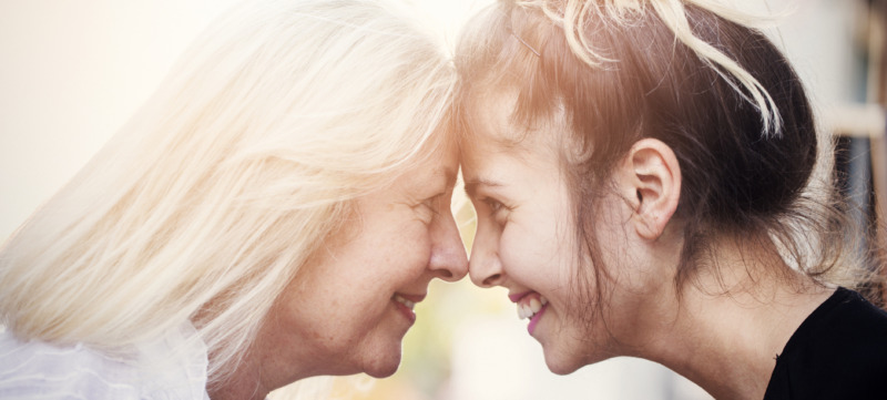 Smiling mother with young daughter