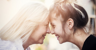 Smiling mother with young daughter