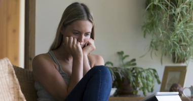 Woman looking stressed with technology