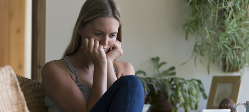 Woman looking stressed with technology