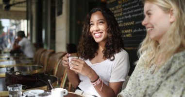 2 young women to the terrace of a parisian coffee