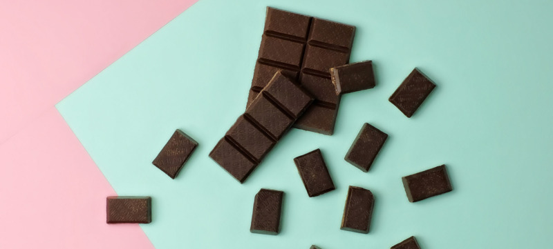 Chocolate pieces on color block background