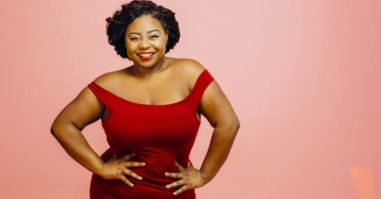 Confident in my body / Portrait of a happy, curvy young woman in red dress