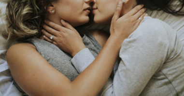 Lesbian couple kissing in the morning