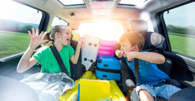 Siblings Playing In Car