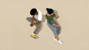 twee mensen zitten op de grond als een illustratie bij een artikel over autisme en hoogsensitiviteit