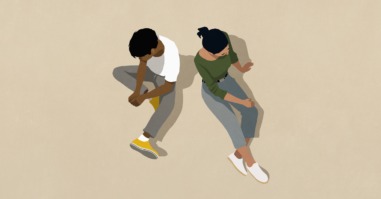 twee mensen zitten op de grond als een illustratie bij een artikel over autisme en hoogsensitiviteit