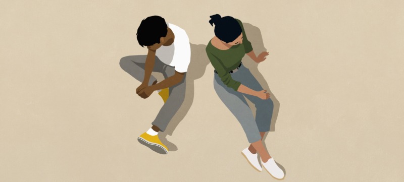 twee mensen zitten op de grond als een illustratie bij een artikel over autisme en hoogsensitiviteit